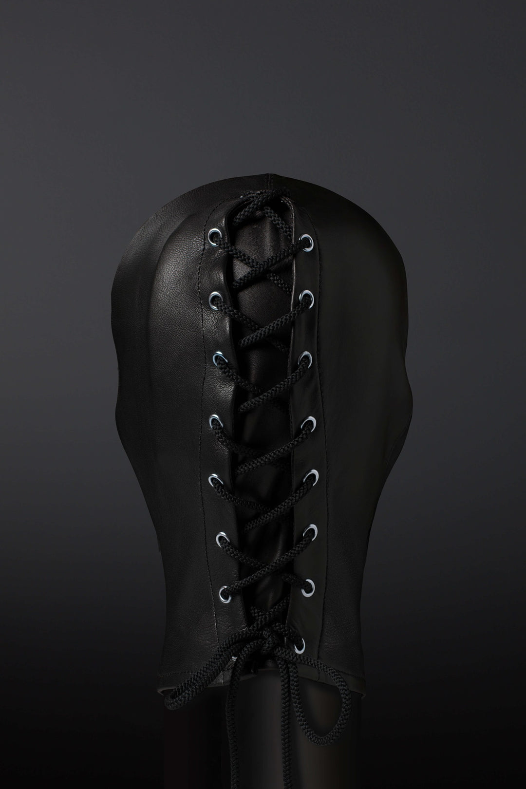 Photo depicting the lacing on the back of a leather hood