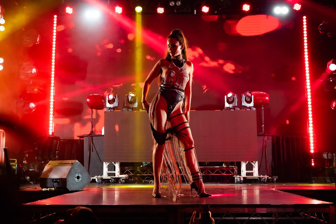 Model wearing a fashion runway ensemble at Torture Garden event