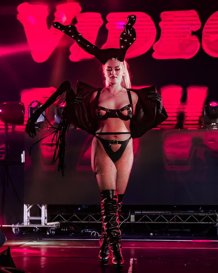 Model wearing a fashion runway ensemble at Torture Garden event