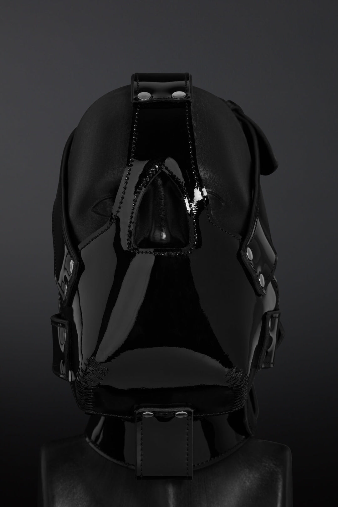 Black leather mask on a dark background