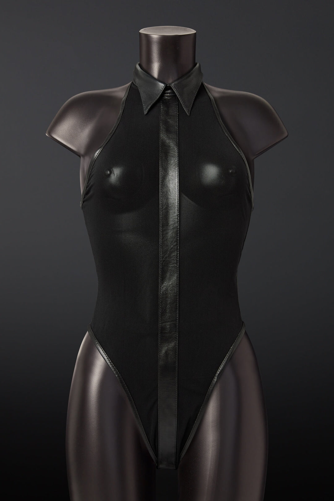 Black leather bodysuit on a mannequin against a dark background
