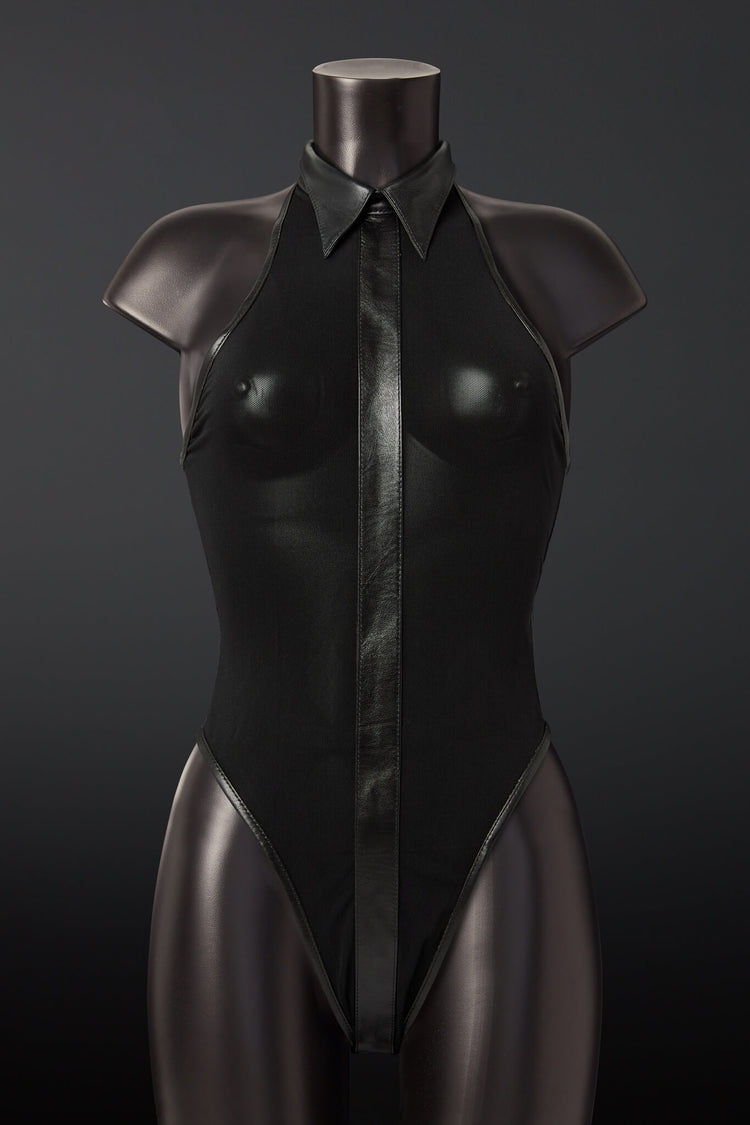 Black leather bodysuit on a mannequin against a dark background