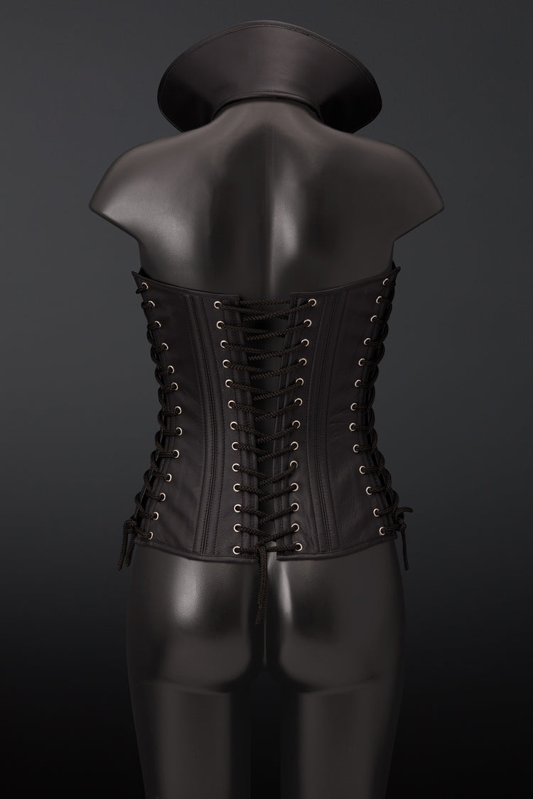 Black leather corset vest with lace-up back closure, displayed on a black mannequin from the back against a dark gray background.