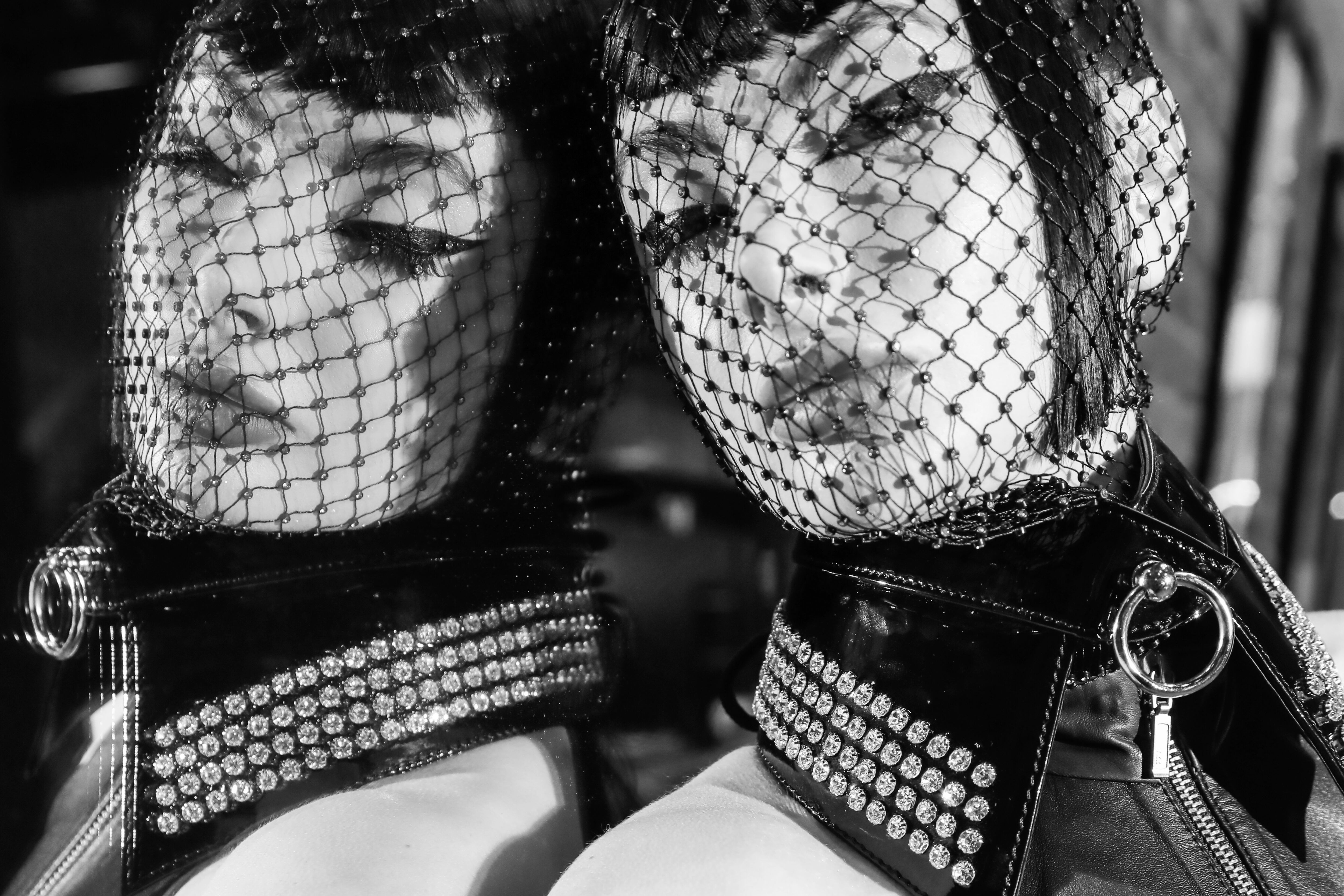Woman wearing the Crystalla Collar with a reflection of her face in a mirror