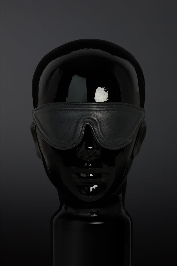 Black blindfold on a dark background