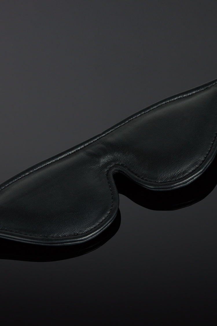 Black blindfold on a dark background