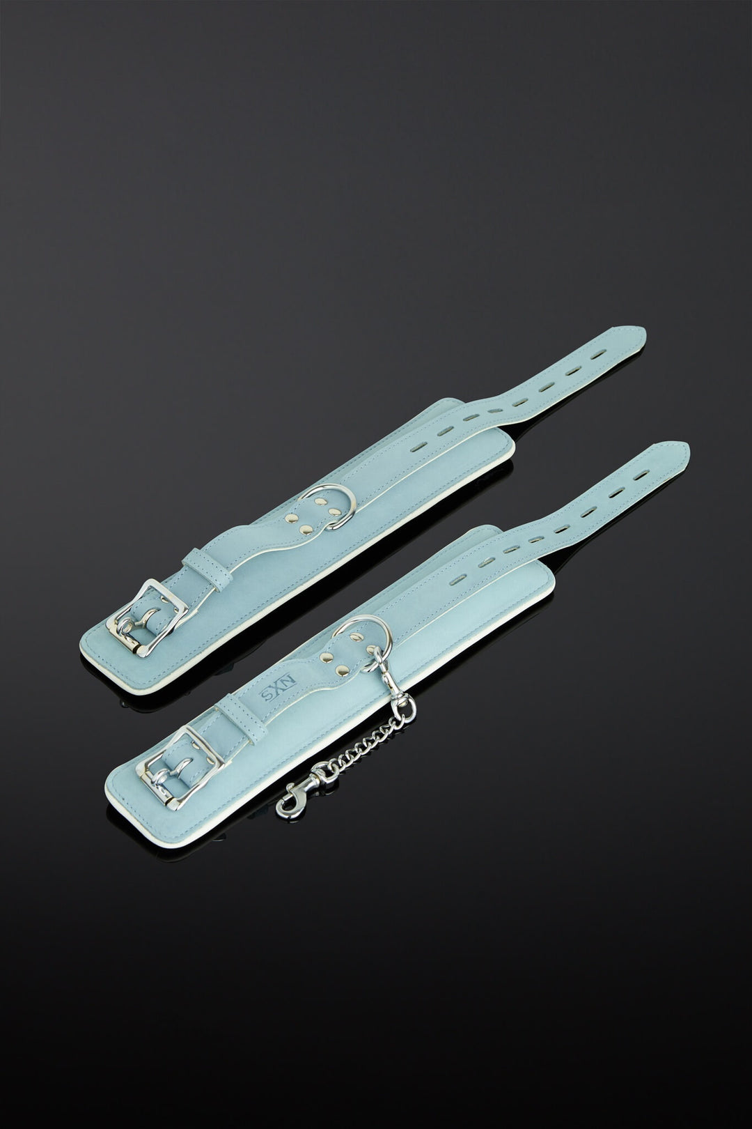 sea green color wrist cuffs on a black background