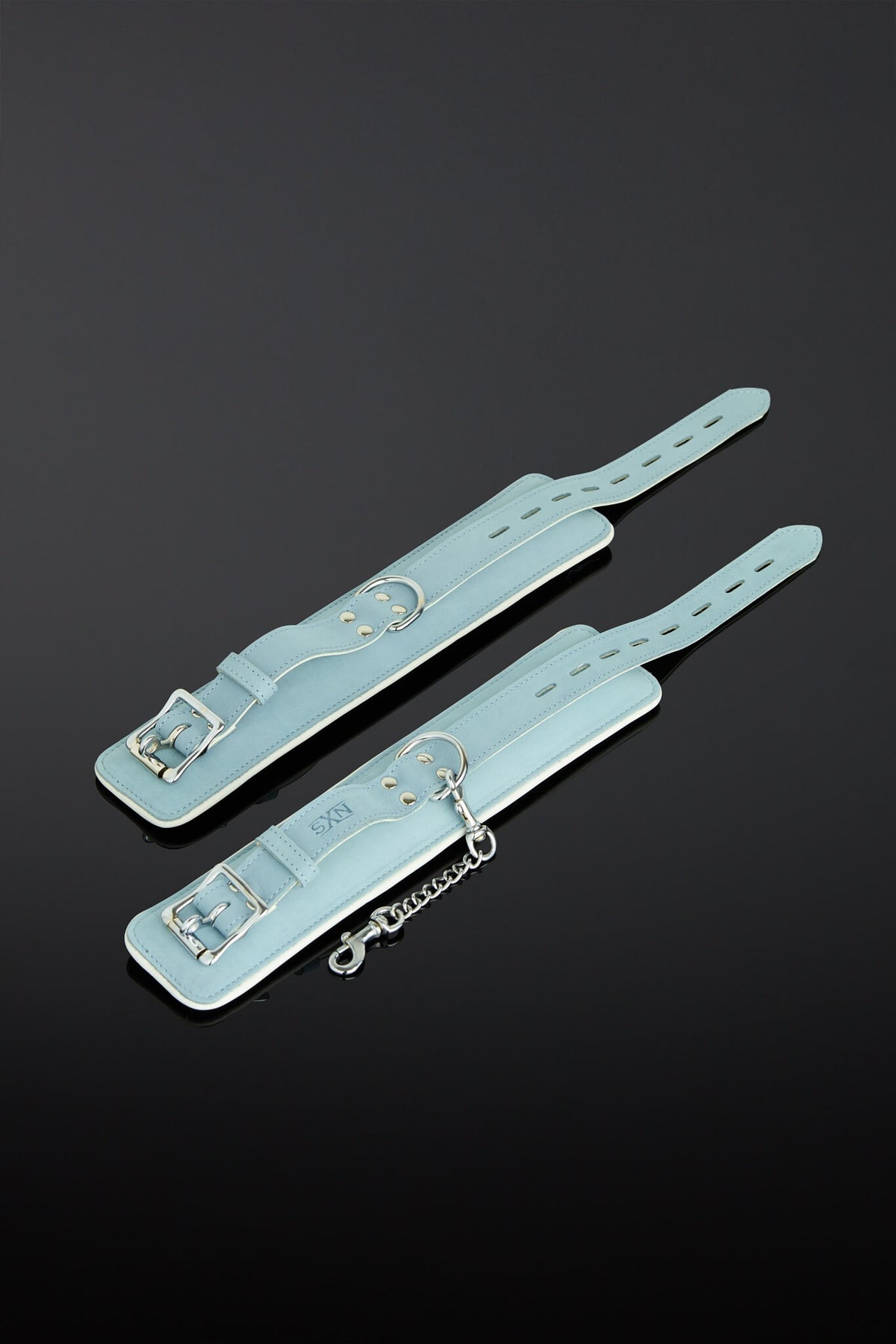 sea green color wrist cuffs on a black background