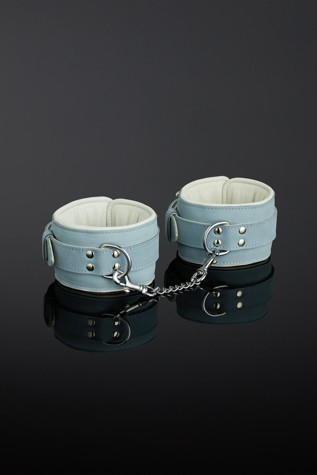 sea green color wrist cuffs on a black background
