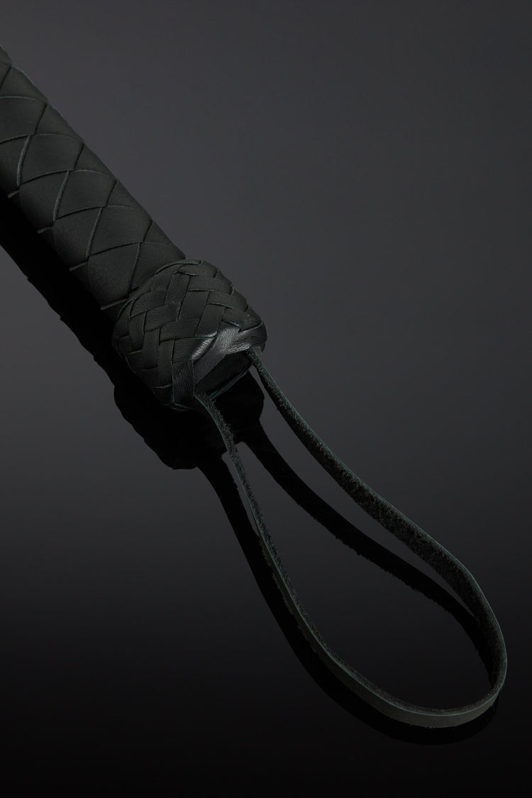 close up photo of a black braided handle. 