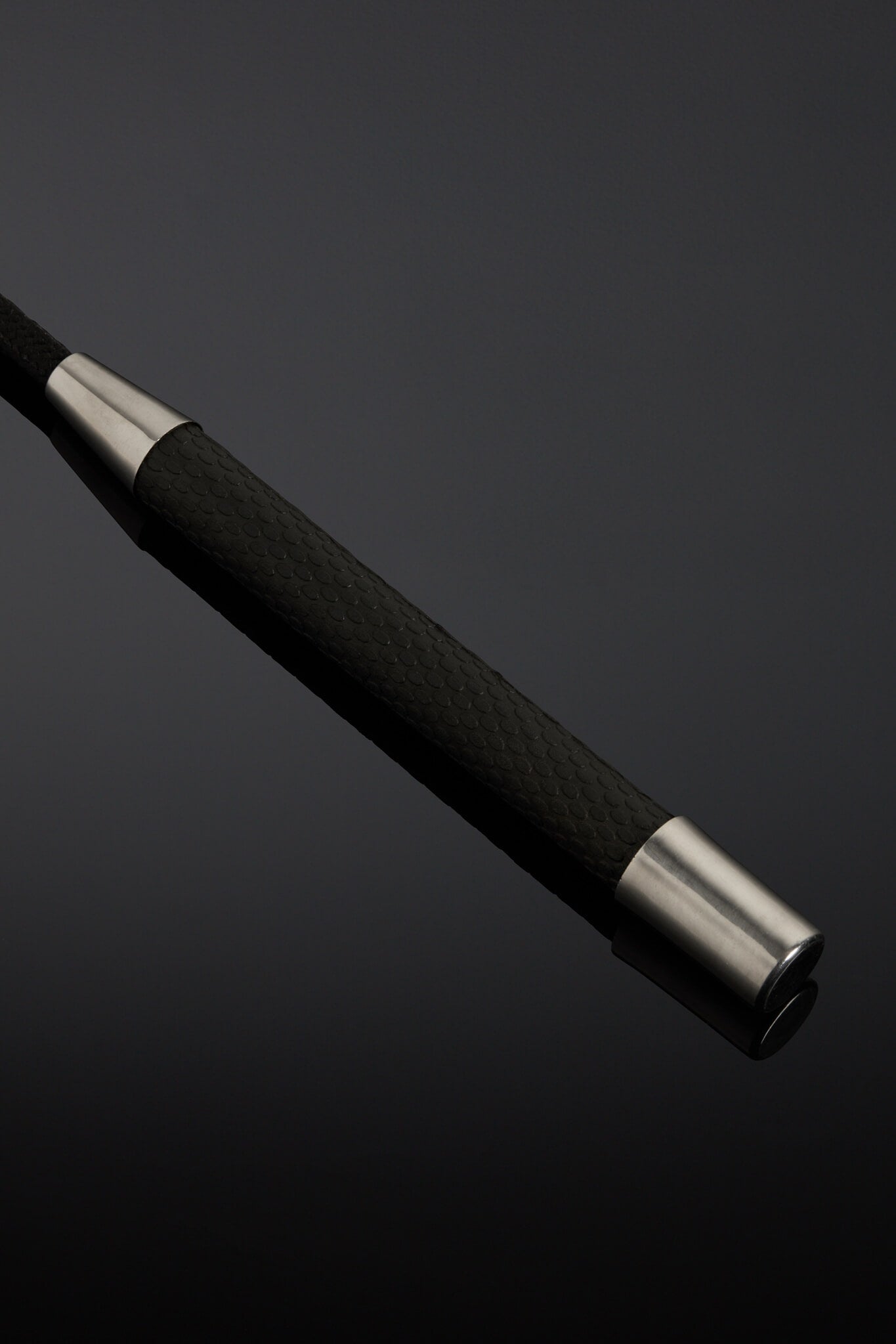 Black Leather crop handle on black background