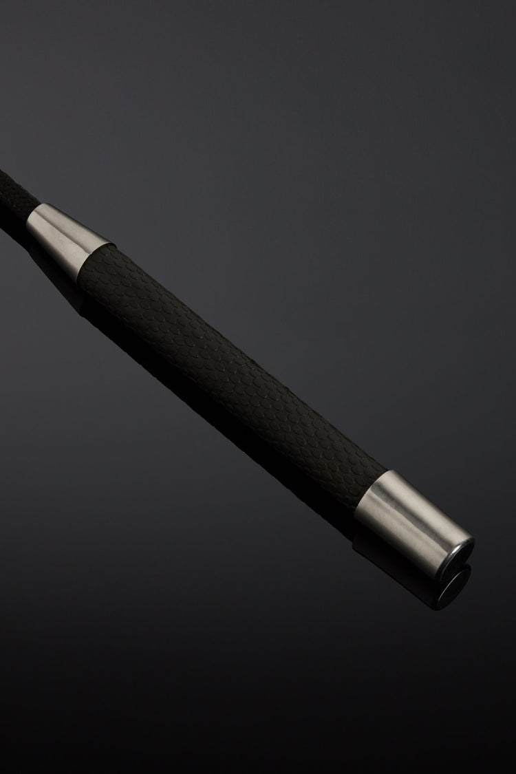 Black Leather crop handle on black background