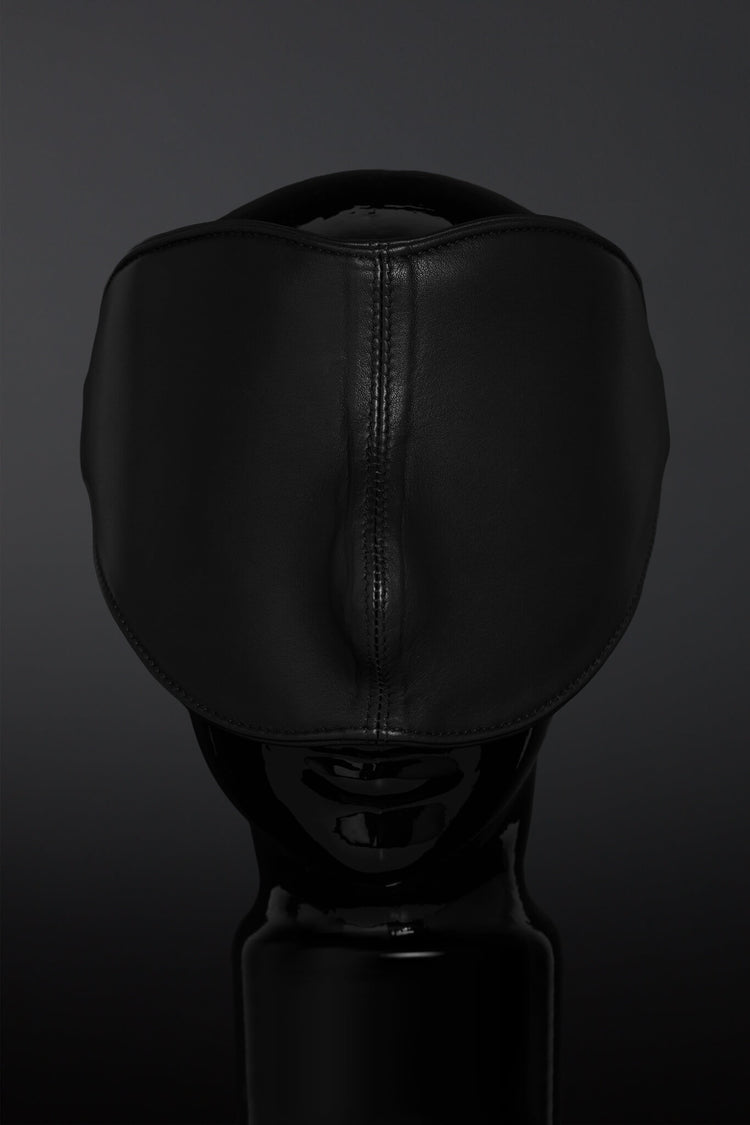 Black leather blindfold on a dark background