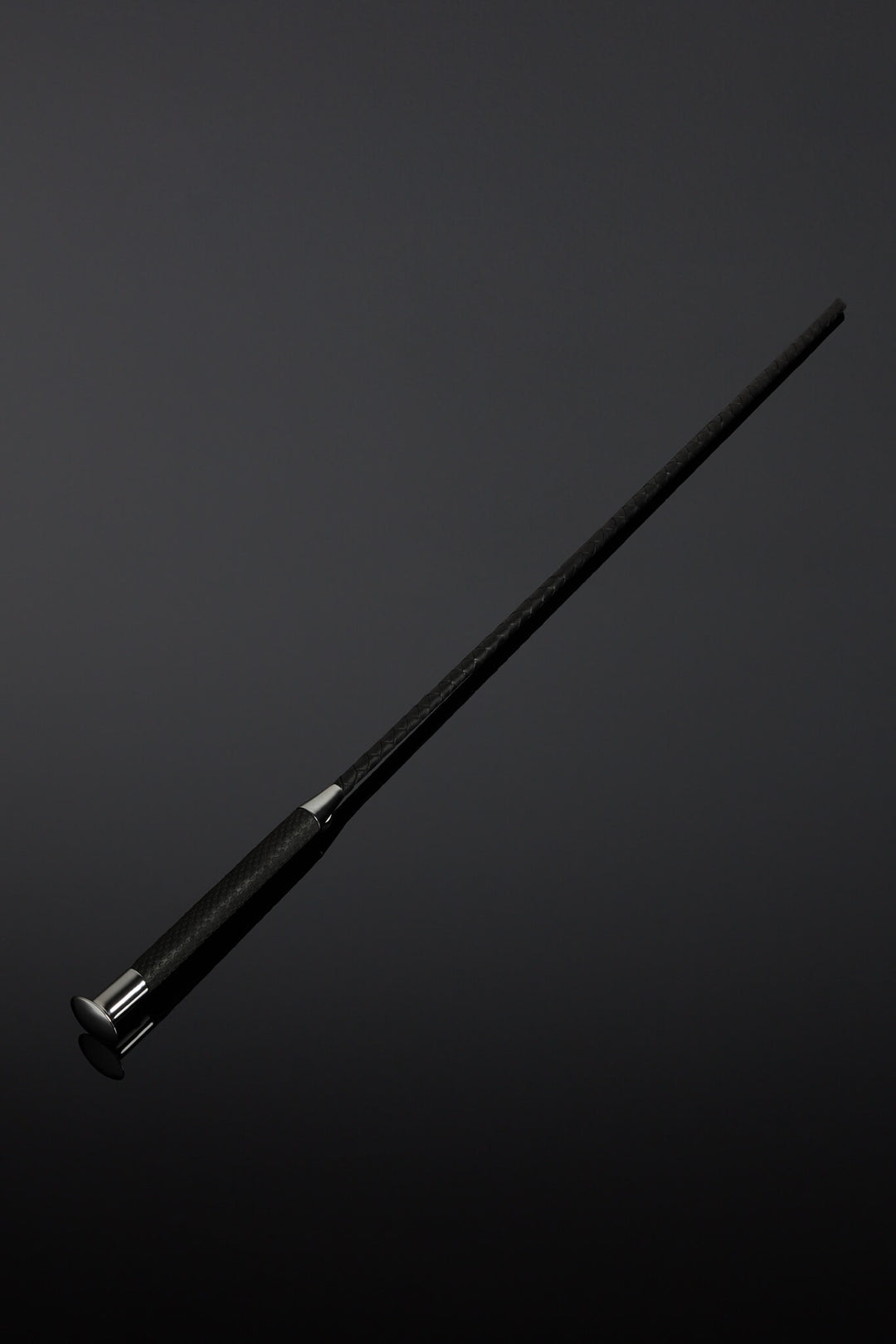 Black cane on a dark gray background