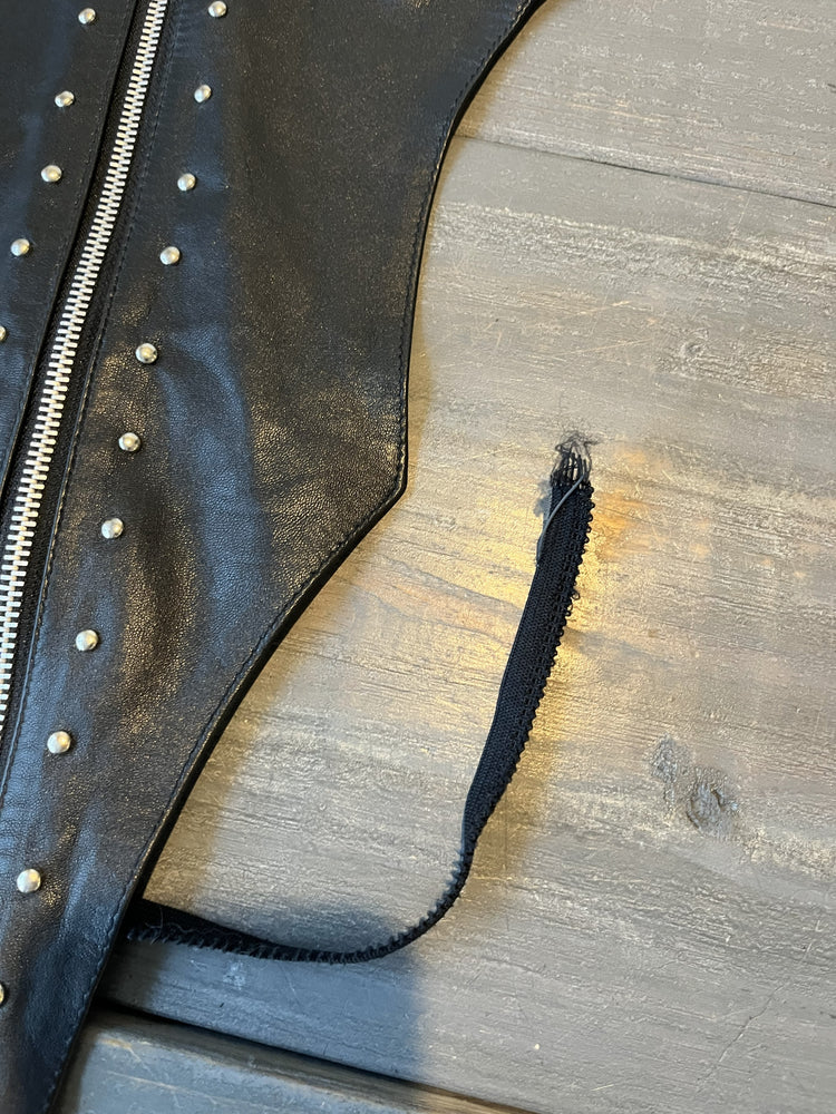 Closeup of leather lingerie torn strap