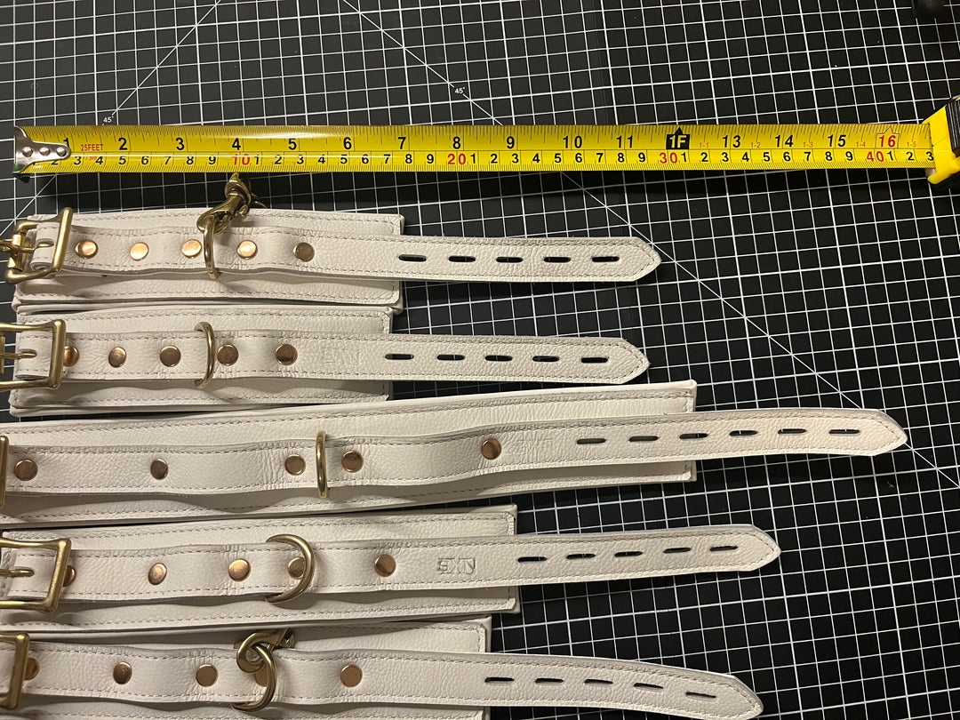 White leather padded cuff set, size small - Sample