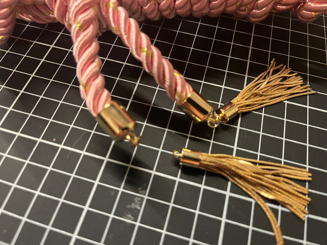 Pink color electro conductive rope, broken tassle.  - Sample
