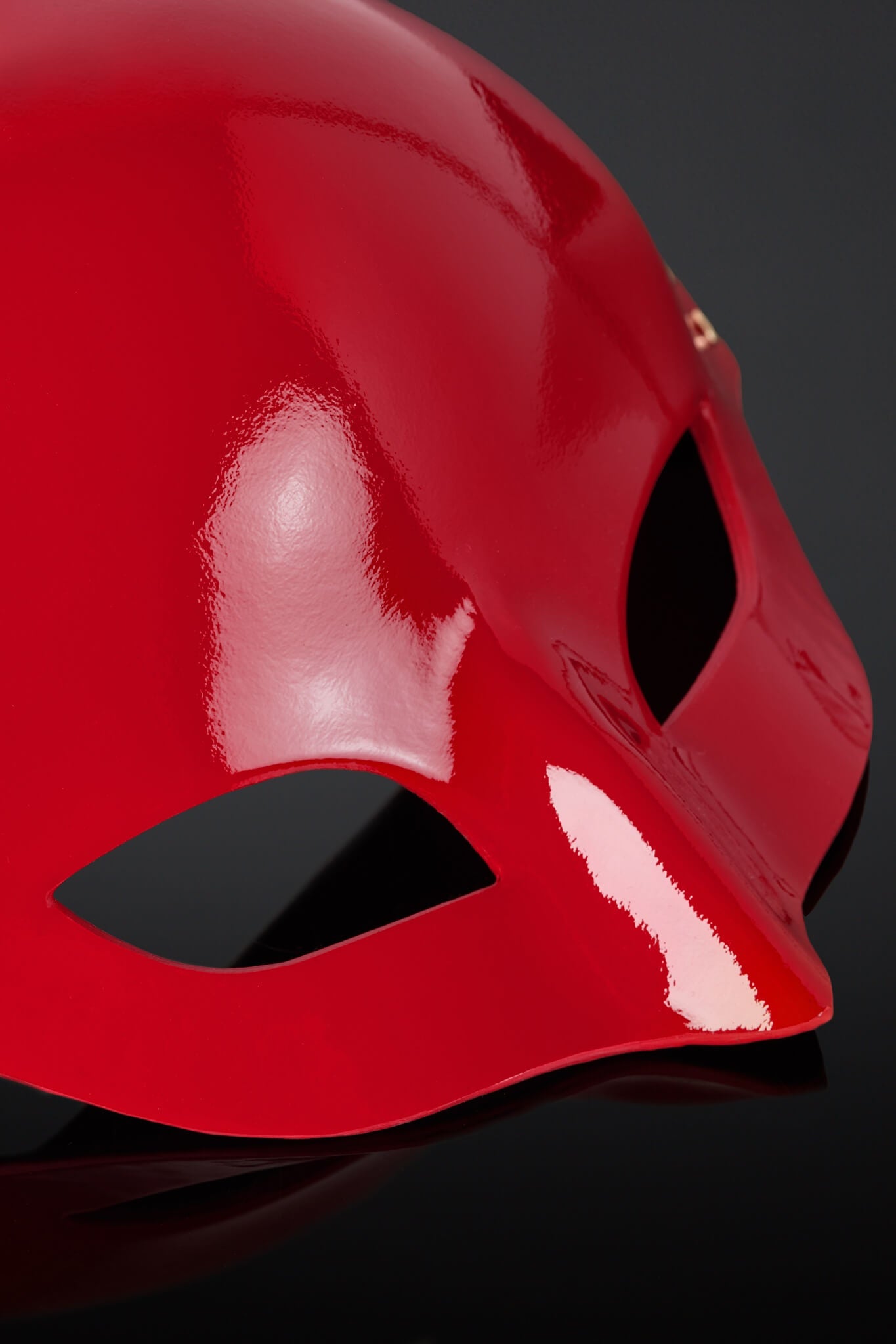 Close-up of a red mask on a black background