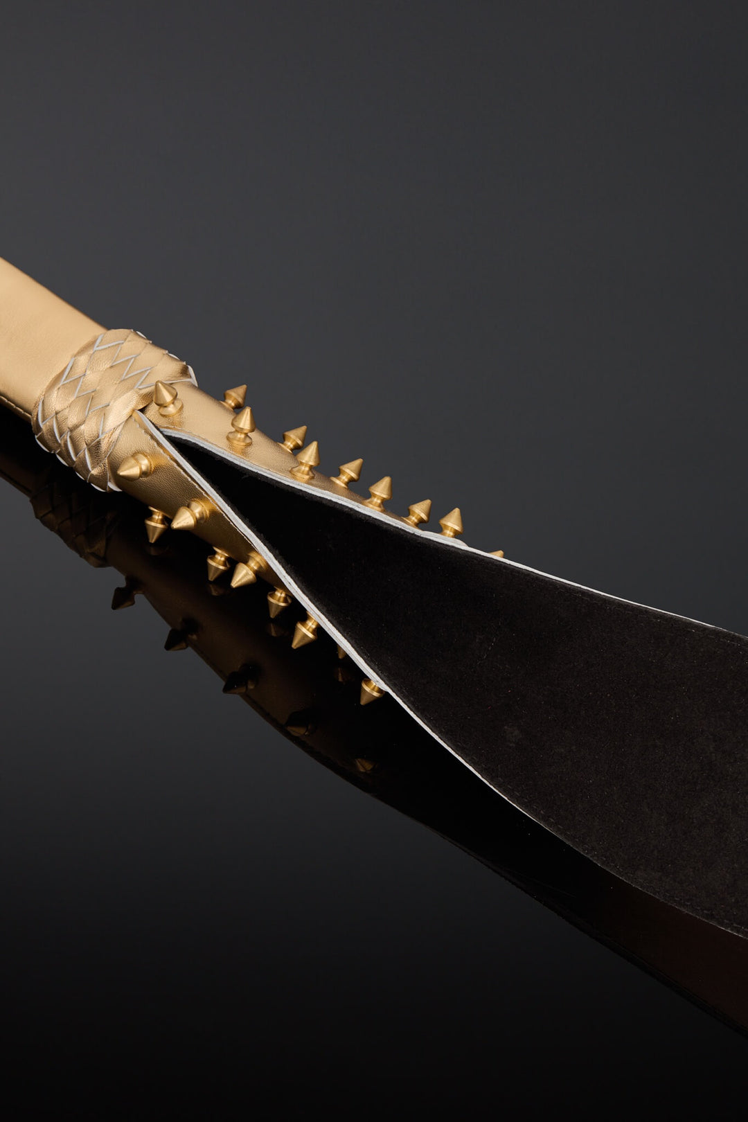 A close-up studio shot of black suede leather on the under side of the tail. 