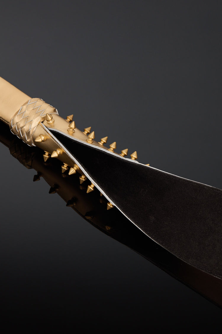 A close-up studio shot of black suede leather on the under side of the tail. 