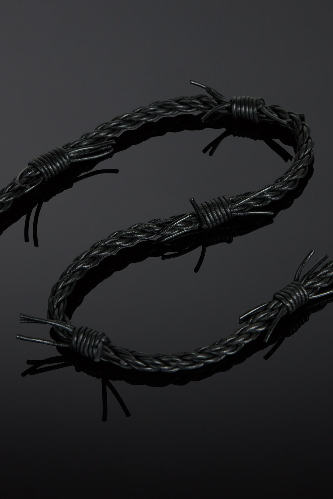 Barbed wire design on a black background
