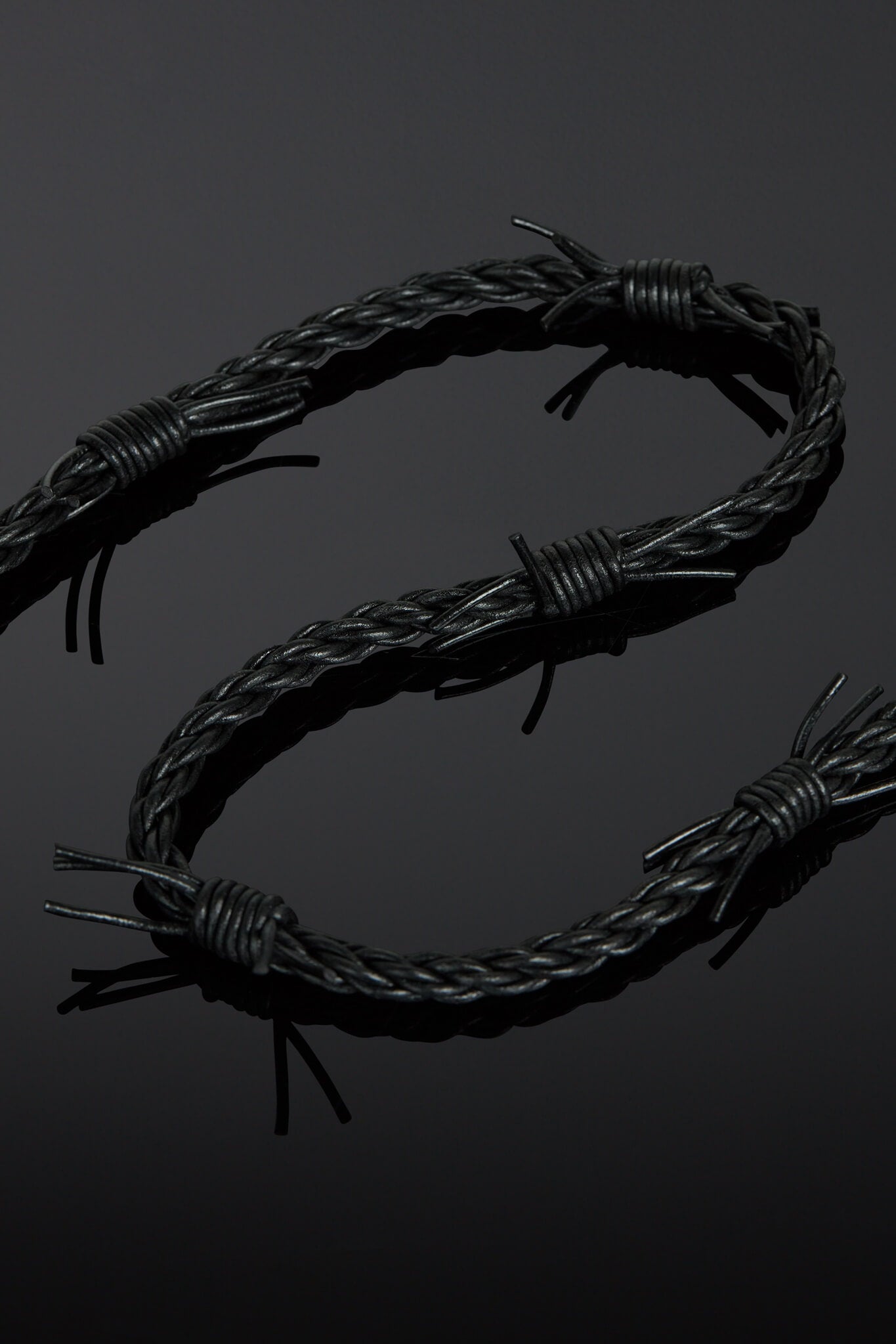 Barbed wire design on a black background